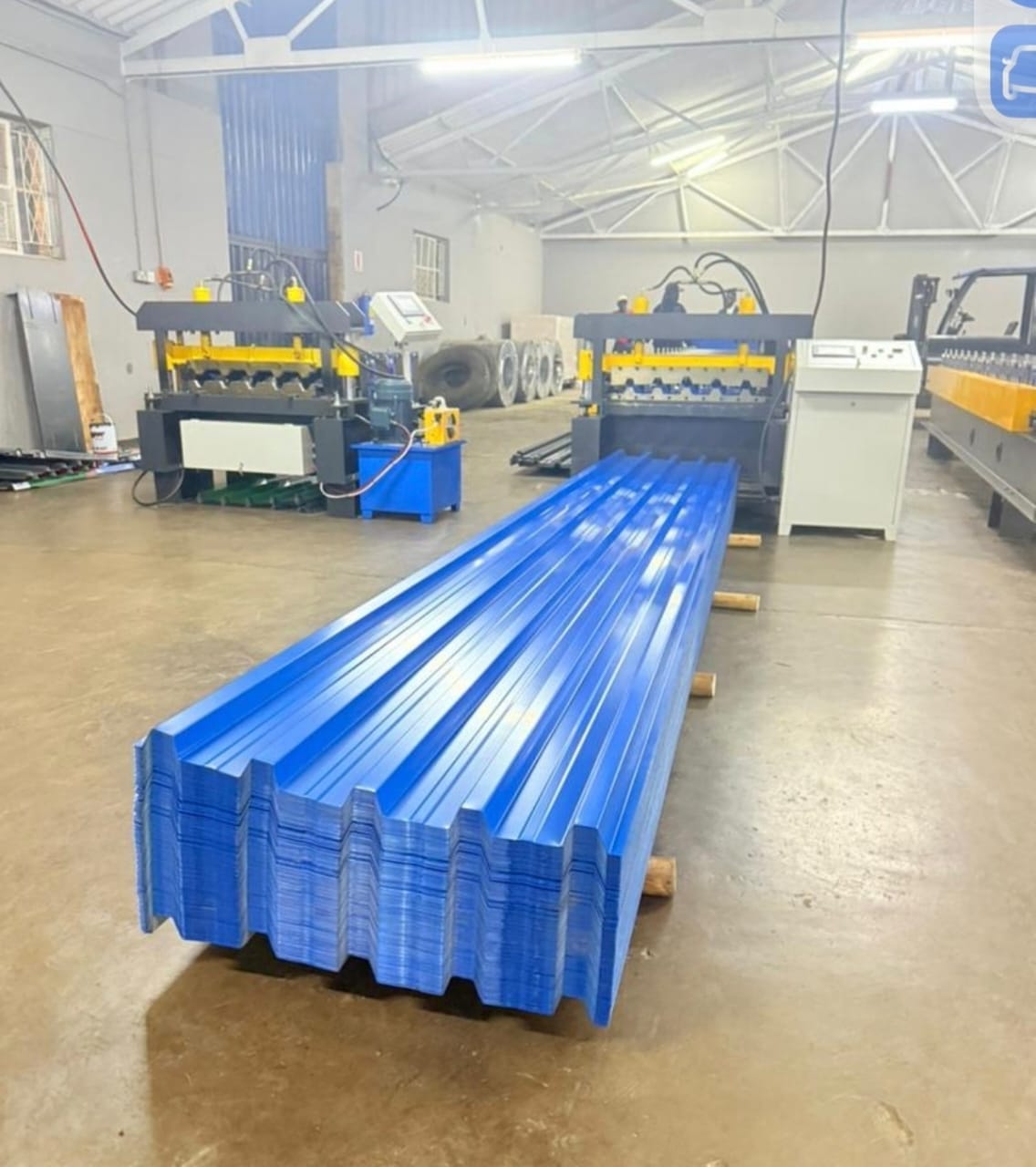 Blue Chromadek roofing sheets being manufactured